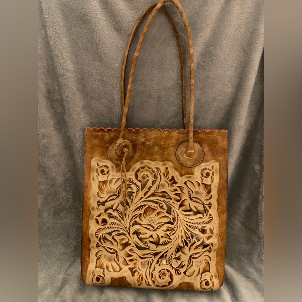 Brown leather floral Patricia Nash bag with gold cut outs and pink interior!